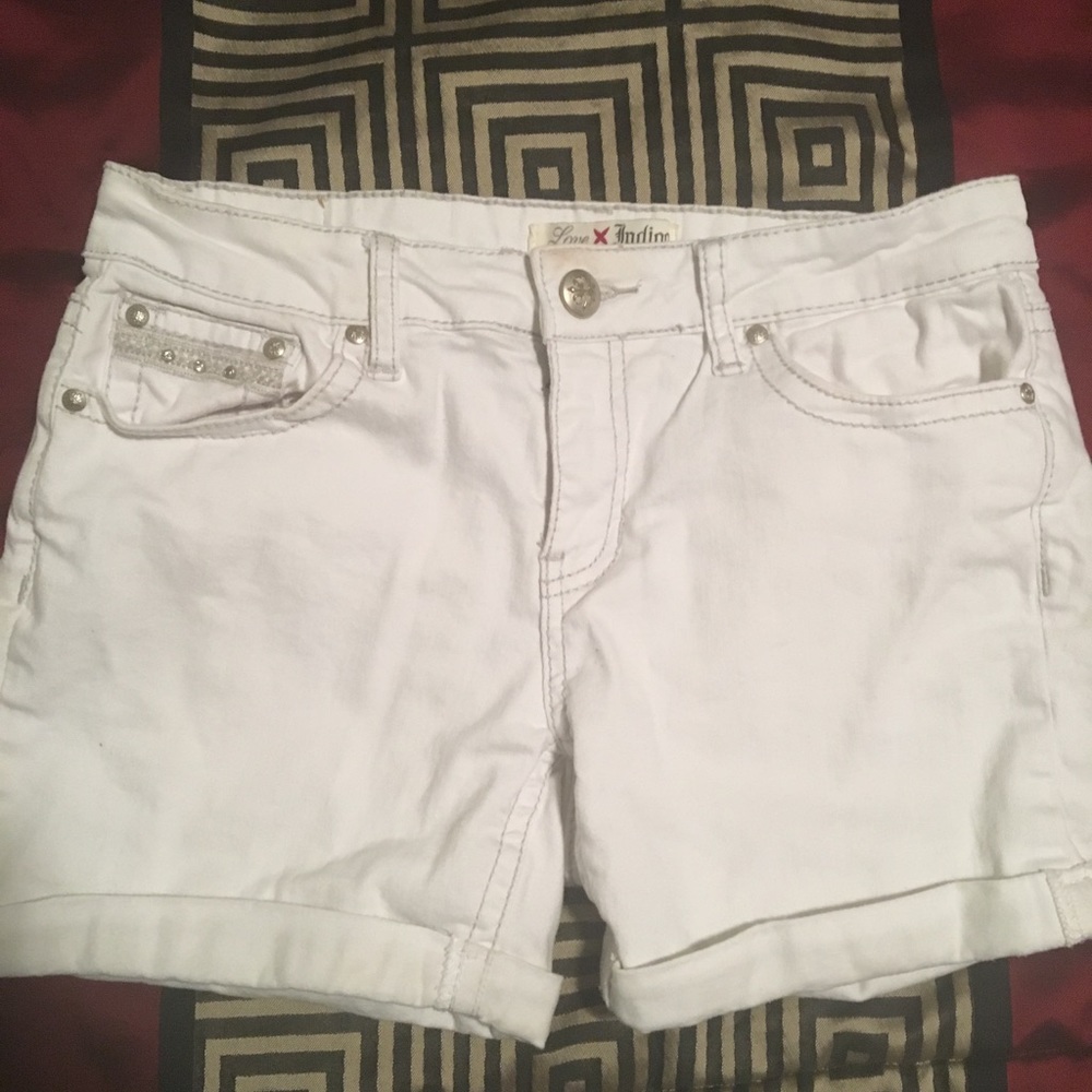 Size 8 women’s white shorts with bling pockets